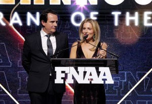 NEW YORK, NEW YORK - DECEMBER 04: (L-R) Ricardo Larroudé and Marina Larroude speak onstage during the Footwear News Achievement Awards (FNAAs) 2024 at Cipriani South Street on December 04, 2024 in New York City.  (Photo by Craig Barritt/Footwear News via Getty Images)