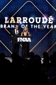 NEW YORK, NEW YORK - DECEMBER 04: (L-R) Ricardo Larroudé and Marina Larroude speak onstage during the Footwear News Achievement Awards (FNAAs) 2024 at Cipriani South Street on December 04, 2024 in New York City.  (Photo by Craig Barritt/Footwear News via Getty Images)