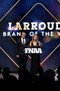 NEW YORK, NEW YORK - DECEMBER 04: (L-R) Ricardo Larroudé and Marina Larroude speak onstage during the Footwear News Achievement Awards (FNAAs) 2024 at Cipriani South Street on December 04, 2024 in New York City.  (Photo by Craig Barritt/Footwear News via Getty Images)