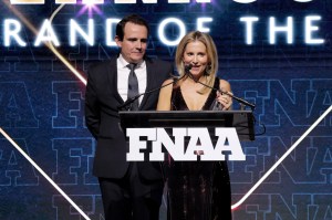 NEW YORK, NEW YORK - DECEMBER 04: (L-R) Ricardo Larroudé and Marina Larroude speak onstage during the Footwear News Achievement Awards (FNAAs) 2024 at Cipriani South Street on December 04, 2024 in New York City.  (Photo by Craig Barritt/Footwear News via Getty Images)