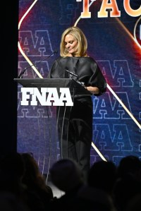 NEW YORK, NEW YORK - DECEMBER 04: Tacey Powers speaks onstage during the Footwear News Achievement Awards (FNAAs) 2024 at Cipriani South Street on December 04, 2024 in New York City. (Photo by Roy Rochlin/Footwear News via Getty Images)