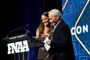 NEW YORK, NEW YORK - DECEMBER 04:  Brooke Burke and David Weinberg speak onstage during the Footwear News Achievement Awards (FNAAs) 2024 at Cipriani South Street on December 04, 2024 in New York City. (Photo by Roy Rochlin/Footwear News via Getty Images)