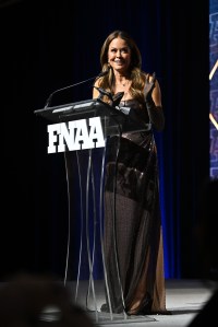 NEW YORK, NEW YORK - DECEMBER 04:  Brooke Burke speaks onstage during the Footwear News Achievement Awards (FNAAs) 2024 at Cipriani South Street on December 04, 2024 in New York City. (Photo by Roy Rochlin/Footwear News via Getty Images)