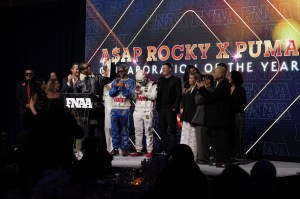 NEW YORK, NEW YORK - DECEMBER 04: Arne Freundt and A$AP Rocky speak onstage at the Footwear News Achievement Awards (FNAAs) 2024 at Cipriani South Street on December 04, 2024 in New York City. (Photo by Craig Barritt/Footwear News via Getty Images)