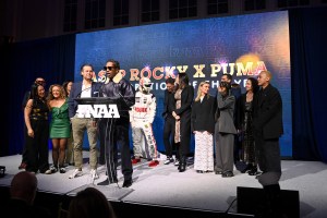 NEW YORK, NEW YORK - DECEMBER 04: Arne Freundt and A$AP Rocky speak onstage at the Footwear News Achievement Awards (FNAAs) 2024 at Cipriani South Street on December 04, 2024 in New York City. (Photo by Roy Rochlin/Footwear News via Getty Images)