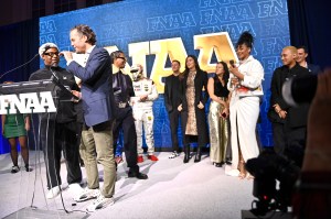 NEW YORK, NEW YORK - DECEMBER 04:  Emory Jones and Arne Freundt speak onstage with A$AP Rocky and Rihanna the Footwear News Achievement Awards (FNAAs) 2024 at Cipriani South Street on December 04, 2024 in New York City. (Photo by Roy Rochlin/Footwear News via Getty Images)