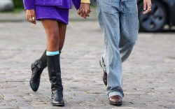 woman and man walking hand in hand wearing fall boots